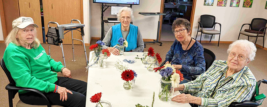 Some of the ladies made floral centerpieces for the Meadows summer family party.